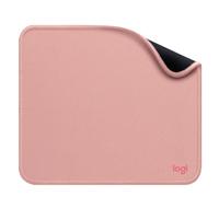 a pink suitcase sitting on a white surface 